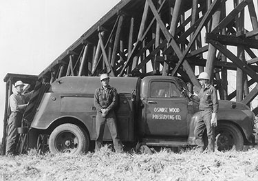 Koppers RS Workers Working Near a Bridge